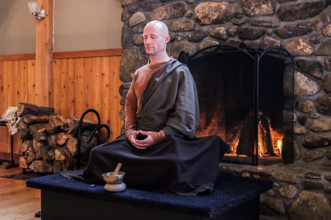 A resident sitting quietly by the fire