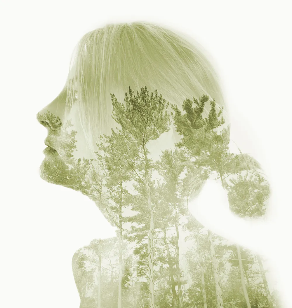 Girl with trees in silhouette